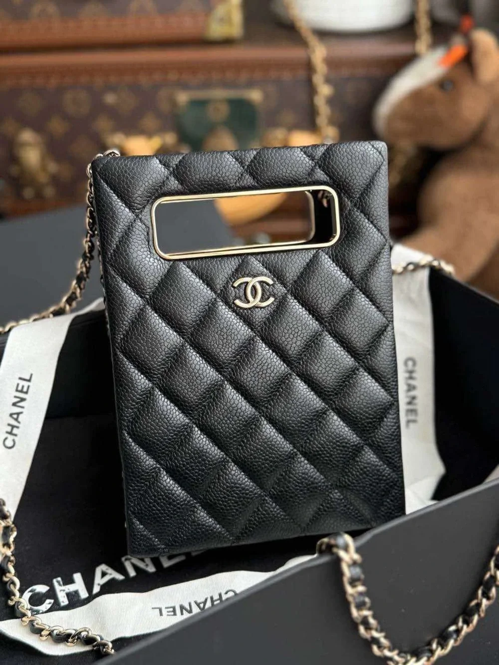 CHANEL Black Quilted Leather Phone Pouch with Gold-Tone CC
